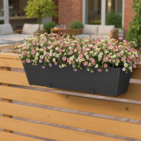 Tough As Nails Two Pack Metal Railing Planter Box 36 Inch Heavy Duty Rustproof Powder Coated Steel Flower Pot with flowers on a railing.