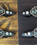 Hella Charismatic Six Inch Wide Set Of Four Western Red Rose Cabinet Pulls With Sweeping Green Vine And Lush Scroll Detailing Hand Cast Resin Drawer Handles Rustic Weathered Finish Kitchen Hardware displayed on wood.