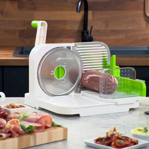 Top Notch Manual Rotary Deli Slicer With A Six Point Five Inch Serrated Blade And Dead Simple Thickness Tweaks Plus Bonus Two In One Peeler.