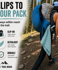 Hiker with Ultralight Backpacking Quick Dry Microfiber Towel for Camping and Hiking clipped to backpack on trail