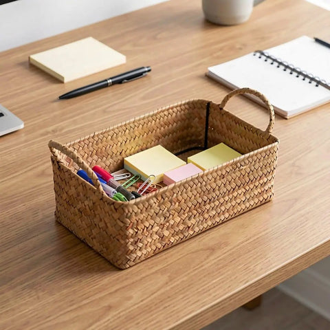 Spacious Open Top Seagrass Woven Storage Basket With Heavy Duty Handles For Kitchen Farmhouse Pantry Bathroom Towels Cosmetics And Hassle Free Daily Organization Goals holding office supplies on a wooden desk.