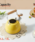 Yellow 1.6 Quart Tea Kettle With Cool Touch Wooden Handle Food Grade Stainless Steel Stovetop Teapot Whistling Kettle For Easy Pour Ergonomic Grip Safe Heat Resistant Kitchen Accessory on white table