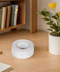 No Gimmicks Solid Grip Clear Double Sided Tape For Wall Mounting And DIY Fixes Weather Proof on a wooden desk.