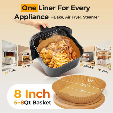8 Inch Square Air Fryer Liners Disposable Parchment Paper in black basket with chicken and fries, fits 5 to 8 Qt ovens.