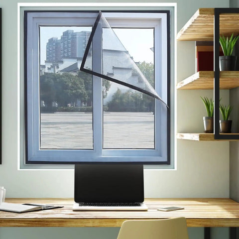 Magnetic screen on office window partially opened, desktop below, showcasing Magnetic Tape Strips Roll With Adhesive Backing.