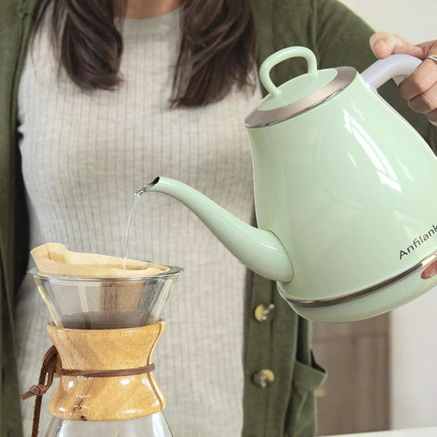 Person pouring water from a Gooseneck Electric Kettle 1L 1500W for Pour Over Coffee and Tea, Stainless Steel BPA Free, Green, into a coffee dripper