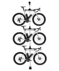 Three Bike Vertical Storage Rack, Floor To Ceiling Freestanding Hanger With 360 Degree Adjustable Hooks showcasing three bikes