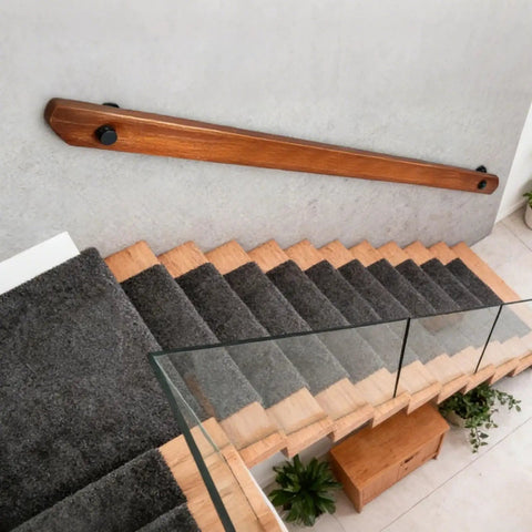 Built Tough Wall Mount Wood Handrail With Industrial Pipe Brackets For Indoor Staircases Hallways And Landings Smooth Non Slip Surface No Sweat Setup Dark Wood Nine Foot above wooden stairs with grey carpeting