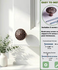 Antique Copper Kitchen Cabinet Knobs Set For 1.4 Inch Cabinets with break-away screws, shown on white cabinet door.