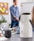 Thermal Coffee Carafe 74oz Stainless Steel Vacuum Insulated Water Jug For Hot Or Cold Beverages on an office table
