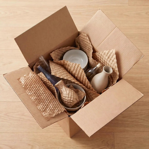 Heavy Duty Honeycomb Kraft Paper Wrap Sheets For Packing And Moving 12 X 12 Inches 100 Sheets used to protect fragile items in a box.