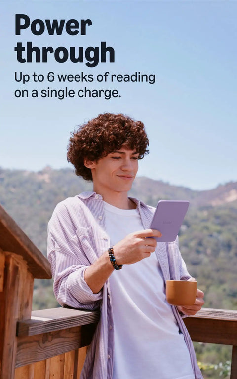 Young man holding a Hustle Free Pocket E Reader With Edge To Edge Color Display And Next Level Six Week Battery Life.