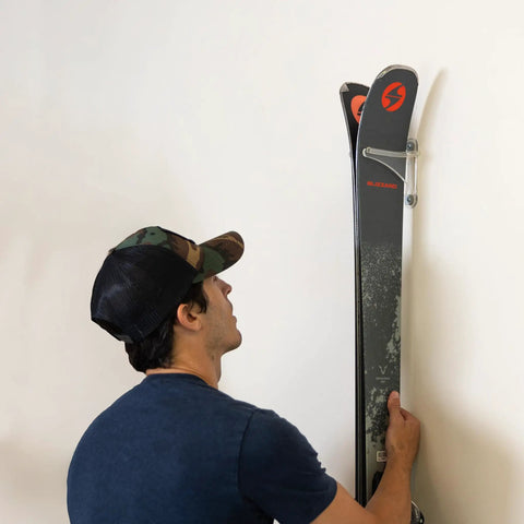 Clear Acrylic Ski Wall Mount 2 Pack Vertical Storage Rack Indoor Display Holder Heavy Duty Snow Gear Hanger showing skis lifted to wall.