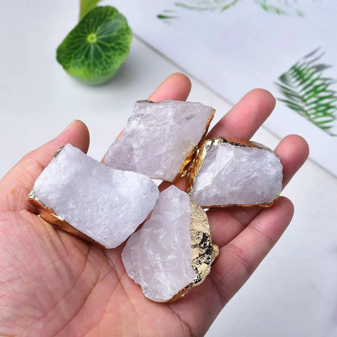 Four Crisp White Geode Cabinet Knobs With Burnished Gold Plating, 35-45 mm, showcasing texture in a hand.
