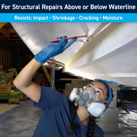 Person applying Fiberglass Reinforced Polyester Structural Repair Putty Quart Kit for Boats and Cars on a boat hull.