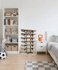 Heavy Duty 6 Layer Skateboard Floor Stand And Wall Mount Rack To Park Longboard Cruiser And Mini Deck Plus Snowboard Storage Rack in a room displaying stacked skateboards.