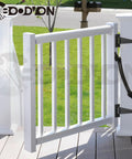 14 Inch Heavy Duty Gate Spring With Adjustable Tensioner Automatic Self Closing For Wood Vinyl And Steel Gates built into a white vinyl fence.
