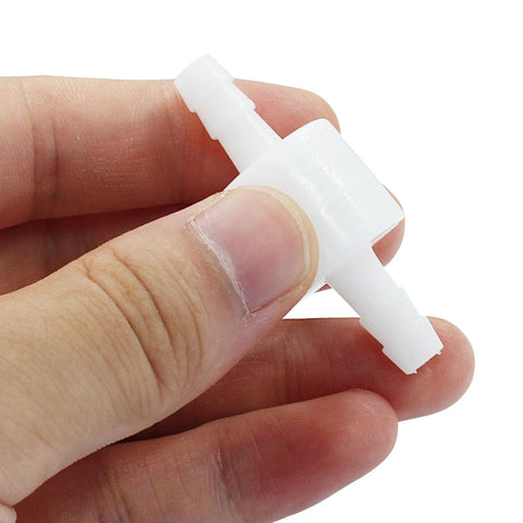 White PVDF plastic 1/4-inch inline check valve with barbed ends.