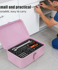 Badass Pink Metal Toolbox With Reliable Locking Latch Built Tough For Your Sweet Ride And Garage Grinds, open with tools inside on floor.