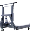 Hardcore Heavy Duty Hydraulic Dual Wheel Dolly For Big Rig Tires With 1500 Lb Capacity, gray carbon steel construction.