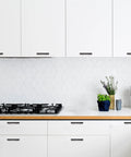 Modern kitchen with oil rubbed bronze curved cabinet handles arch drawer pulls for kitchen 3 inch hole centers 25 pack displayed on white cabinetry.