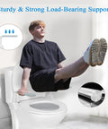 Rock Solid Toilet Safety Rails With Adjustable Grab Bars And Non Slip Bailout Handles Keep Everyone Steady While Using The Commode Space Saving Bathroom Assist Design. Person using grab bars for stability.