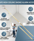 Heavy Duty Aluminum Telescoping Reach Pole For High Ceiling Smoke Detector Removal And Facility Maintenance With Knockout Grip Handles And Secure Locking Collars being used to access a smoke alarm.