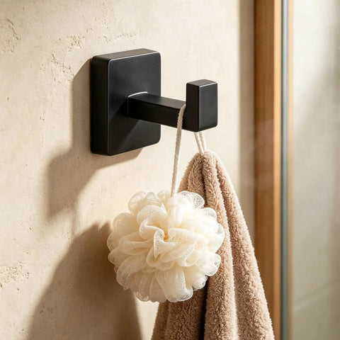 Solid Double Hook Wall Mount For Small Bathrooms Sleek Silver Finish Space Saving Towel Rack With Heavy Duty Grip Easy Wipe Design That Totally Flips Your Messy Vibe Today with a shower pouf and towel.