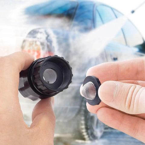 Hands holding a 20 Pack Stainless Steel Hose Filter Washers With Screen Inlet Strainer For 3/4 Inch Garden Hose Connector And 5/8 Inch Washing Machine with a blurred car wash background.