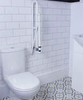 Heavy Duty Stainless Steel Toilet Safety Rails Featuring A Foolproof Flip Up Mechanism With Sturdy Leg Support For Secure Bathroom Access And Comfortable Shower Assistance mounted beside a toilet.