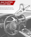 Heavy Duty Harmonic Balancer Puller Set 46 Piece Kit with 4-way slotted puller yoke on car steering wheel.