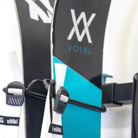 Heavy Duty Wall Mount Ski Rack That Locks Up To Five Pairs Smoothly holds skis with rubberized spring hooks for secure storage.