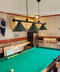 59 Inch Hanging Pool Table Light With Three Shade Billiard Lamps, Adjustable Chain in a game room with green finish