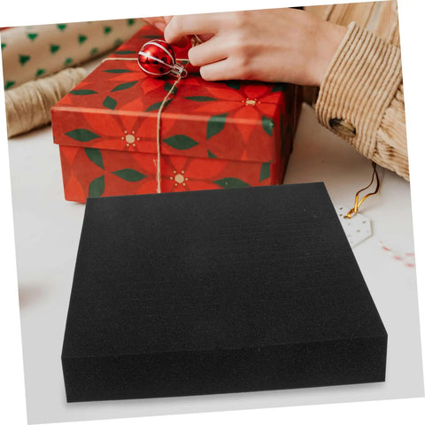 Four Pack Heavy Duty Polyurethane Foam Sheets High Density Cushioning For Toolboxes And Vehicle Cases Hella Durable Stain Absorbing Cleaning Pads in a flat position with a holiday gift background.