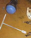 Heavy Duty T Handle Socket Wrench For Motorcycle And Atv Bolts on wooden surface with tools, silver metal design for quick repairs.