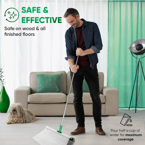 Man using huge wet floor wipes for squeegee stick, cleaning wood floor, couch and dog in the background, text overlay present.