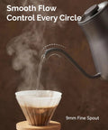 Gooseneck Electric Kettle With Precise Temperature Control Plus Or Minus One Degree Fahrenheit pouring water into coffee filter