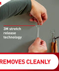 Person using Clear Small Wire Toggle Hooks Set With 40 Hooks And 48 Adhesive Strips For Damage Free Hanging And Super Easy Organization