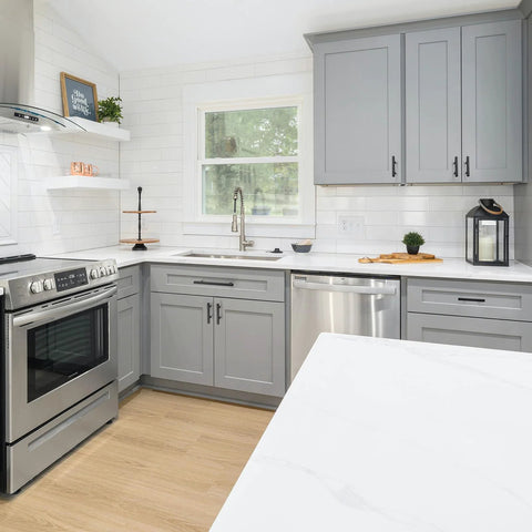 Modern kitchen with gray cabinets featuring Matte Black Square Cabinet Handles 30 Pack Stainless Steel Pulls for Kitchen and Drawers.