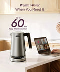 Fast Boiling 1.7L Electric Kettle With Plastic Free Interior And 5 Presets For Tea And Coffee on kitchen counter with laptop.