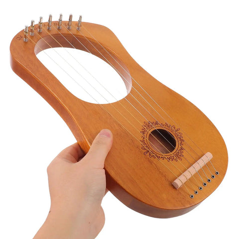7 String Lyre Harp Starter Kit With Tuning Wrench Extra Strings And Music Sheet Book wooden mini harp in hand