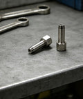 Two Pack Pro Grade Extra Reach Grease Coupler Repair Tool Kit With Steel Tips on workbench