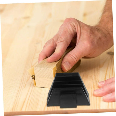 Person sanding wooden surface with sandpaper block beside Modular Wrench Organizer Rack 12-Piece Plastic Tool Storage Tray.