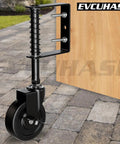 4 Inch Spring Loaded Gate Caster Wheel With Side Brake, 360 Degree Swivel attached to wooden gate on outdoor stone path