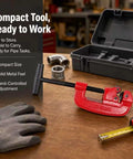 Versatile Pipe Cutter For One Eighth To Two Inch Tubing, Portable Tube Cutting Tool For Plumbing And DIY Projects, Handy, Compact, Lightweight And Easy To Use, Delivers Clean Cuts. Red pipe cutter with case on workbench.