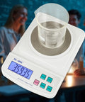 Digital Lab Scale With Zero Point Zero One Gram Precision For Education And Chemistry Labs displaying weight in beaker