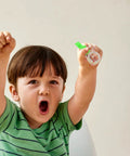 Child excitedly holding a Directional Thumb Orienteering Compass Handheld Outdoor Navigation Tool For Hiking And Camping.