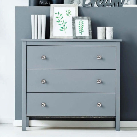 Four Pack Bulldog Pattern Cabinet Knobs With Black Base And Crystal Glass on gray dresser, sleek dog themed handles