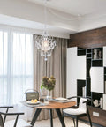 Plug In Mini Crystal Chandelier, White Retro Ceiling Light above dining room table with iron frame accents.