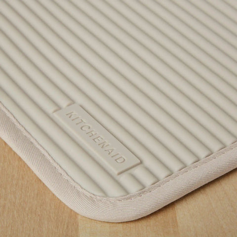 Ribbed Soft Silicone Pot Holder 2 Pack Set Hella Heat Resistant To 500F in Milkshake Tan with textured grip surface.
